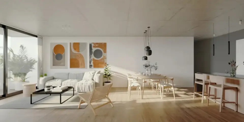Living con sillón, mesa de comedor y cocina integrada